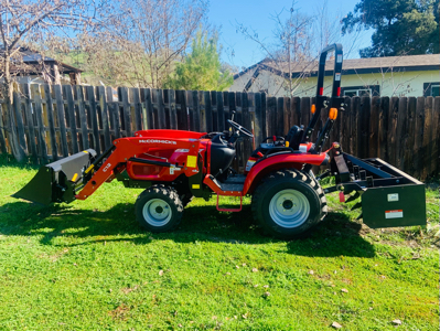 25 HP tractor with loader and box scraper