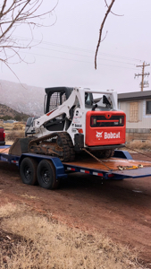 Skid steer with trailer