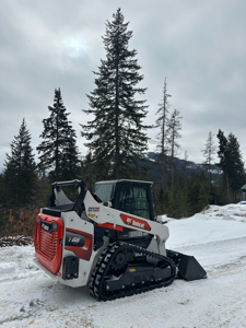 Skid Steer track loader and dump trailer