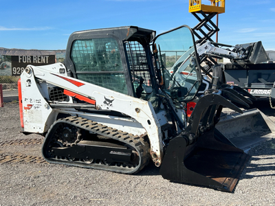 Rubber track skid steer with most implements available