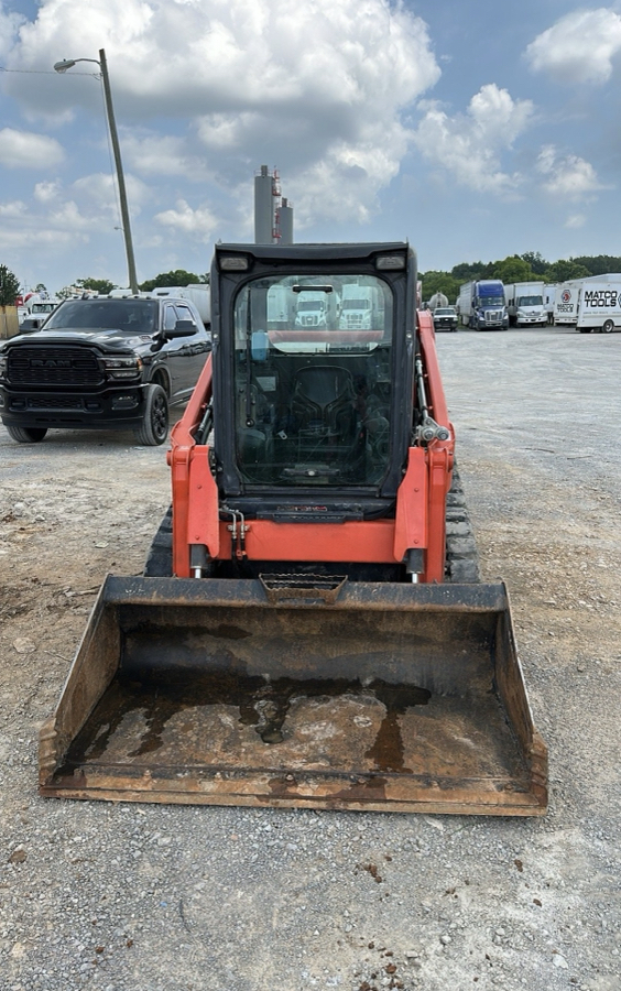 Track close cab skid steer