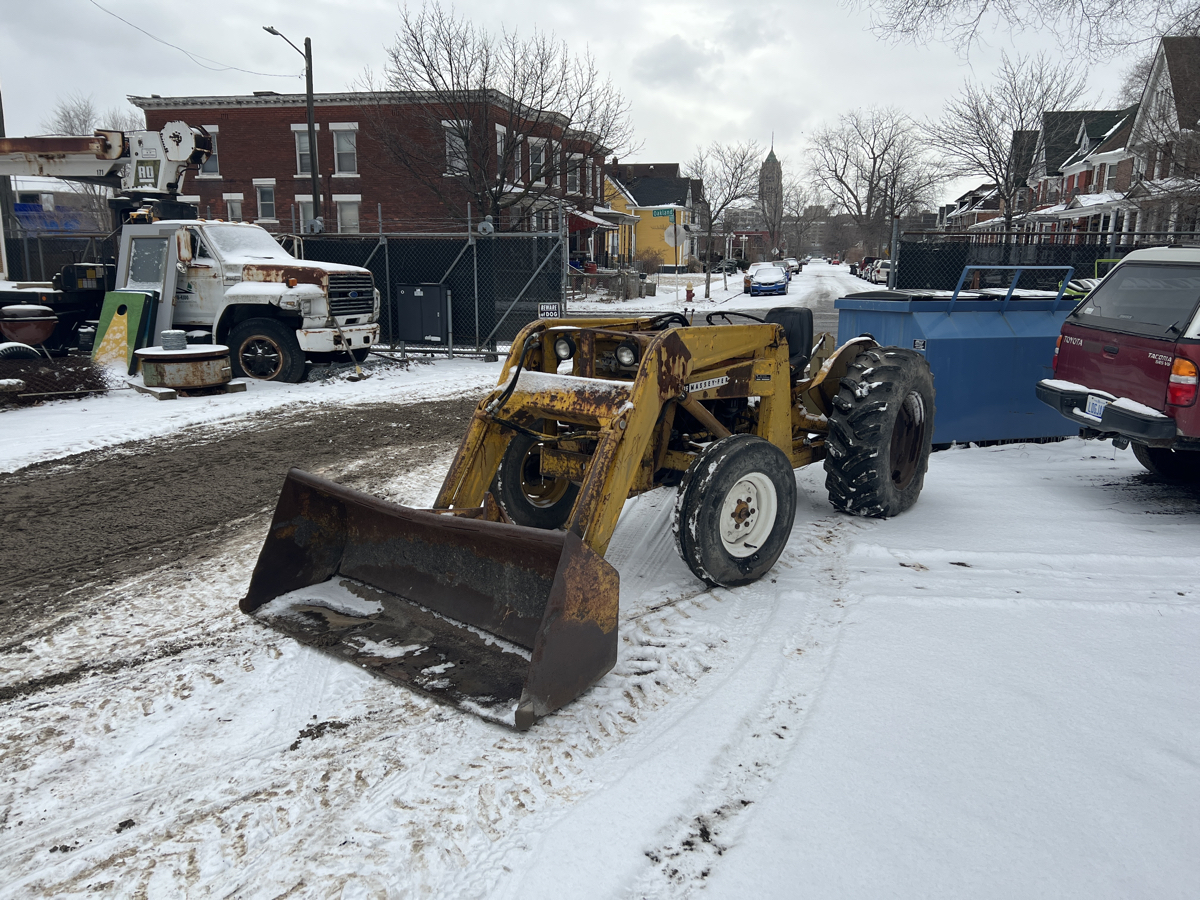 Tractor loader with mini backhoe