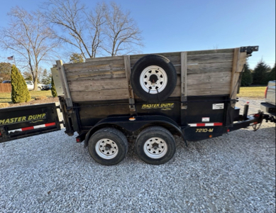 6x10 dump trailer 10,000 lb max has high walls and cover